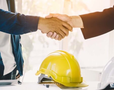 Successful deal, male architect shaking hands with client in con